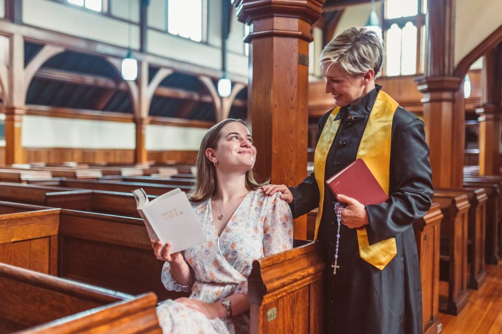 woman-in-floral-dress-sitting-on-wooden-pew-8674878 Woman in Floral Dress Sitting on Wooden Pew
